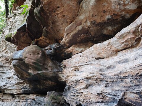 Eroded sandstone overhang at Pha Li Waterfall in Thailand