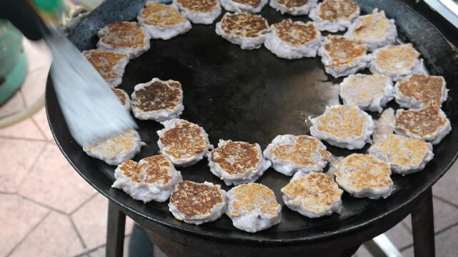 Making Khanom Babin (Thai coconut cakes or pancakes), traditional dessert, street food, Thailand. It is believed that the dessert was originated from Ayutthaya period. 
