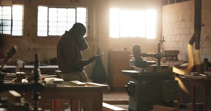 Carpenter, stress and man with tablet in workshop for supplier delay, order error or high price. Tech, woodwork or frustrated black person with project mistake, material cost inflation or scope creep