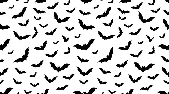 Seamless pattern of black bats isolated on white background