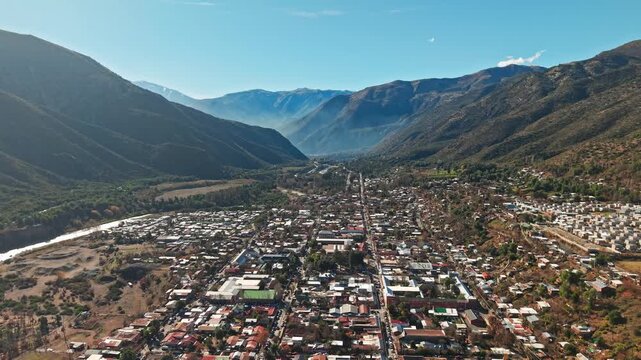 Aerial Establishing Dolly In Above San Jos&eacute; de Maipo Town in Caj&oacute;n del Maipo Chile Andes Mountains High Frame Rate