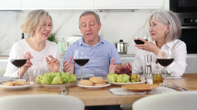 Joyful retirees gathered around a celebratory table, engaging in lively conversations and indulging in the pleasures of red wine