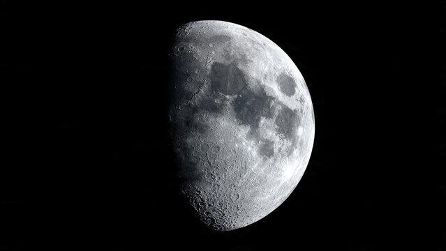 Half moon glowing in the dark night sky with crescent astronomy celestial astrology universe satellite astrophotography astronomical