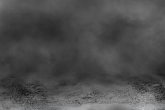 Concrete floor with smoke or fog in dark room with spotlight. Grungy asphalt night street, black background, black and white