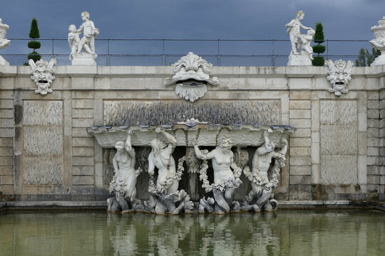 Triton Fountain with Baroque Sculptures at Belvedere Palace in Vienna.