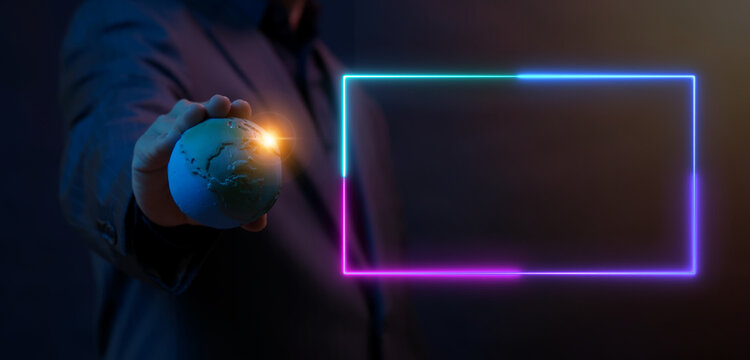Businessman holding world globe with glowing neon rectangular border frame layout with copy space overlay. Global business connectivity framework, text copy space frame, and display portal concept.