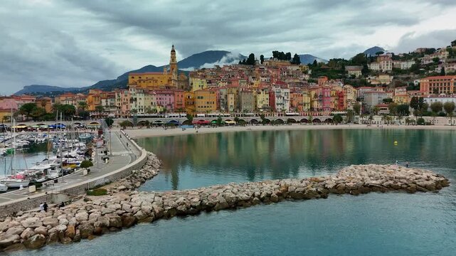 MENTON, FRANCE - NOVEMBER 1, 2025: Aerial view of Menton, France, showing the colorful buildings along the coastline and the harbor
