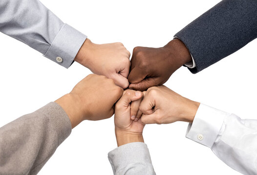 Teamwork and unity concept with diverse hands stacked together in solidarity and cooperation