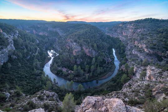 Majestic canyon and river landscape at twilight in Hoz de San Vicente