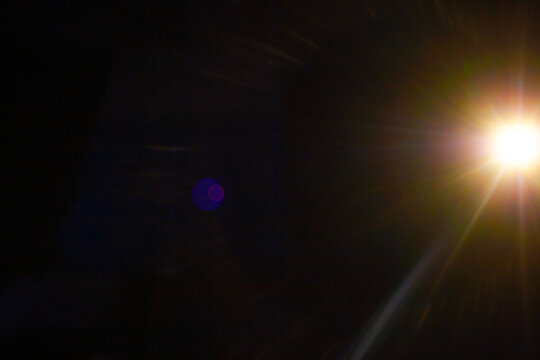 Sun flare on the black background