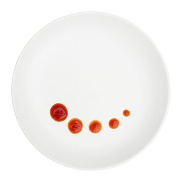 red chili sauce decoration on white circle plate isolated on white.