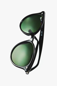 Ray Ban Black classic sunglasses with green polarized lenses isolated on white background, Warsaw, Poland, August 4, 2026