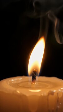 Close-up of Candle Flame Burning in Darkness - A macro shot captures the vibrant flame of a lit candle against a dark background.