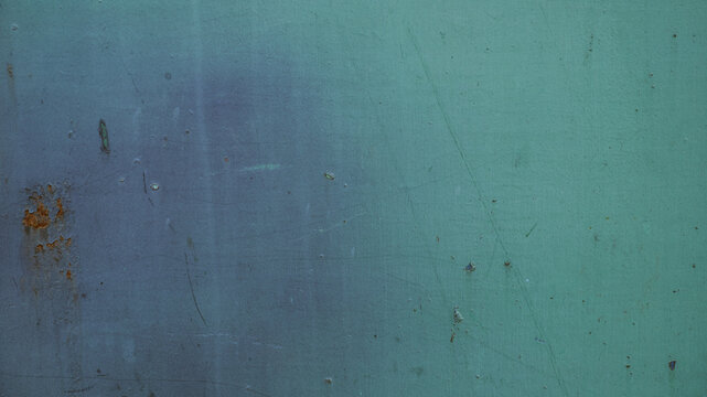 Teal green painted metal surface texture background with scratches and rust spots, vintage weathered steel sheet backdrop for abstract industrial graphic design wallpaper project.