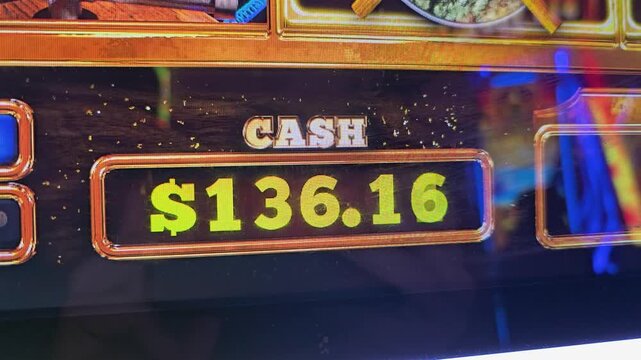 Vibrant slot machine display showing a win message and rising credit total, with gold coin graphics, LED glow, reflections, and casino floor atmosphere for gaming videos.