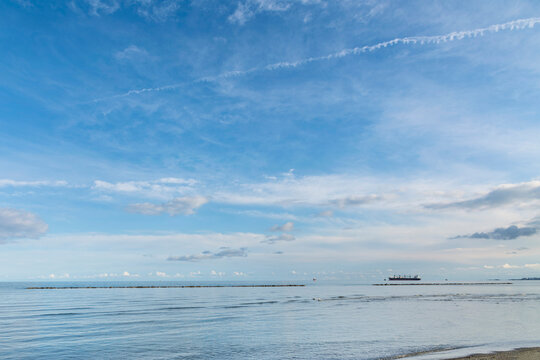 Tropical Mediteranean beach cloudy deep blue sky 