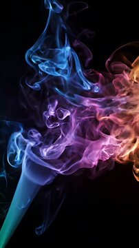 Vibrant Multicolored Smoke Swirling on Black Background - A dynamic plume of vibrant, multicolored smoke flows and swirls across a stark black background.