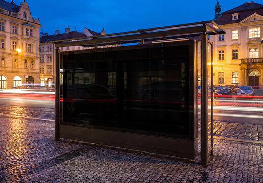 Large horizontal panoramic billboard bus shelter in european city at night Mockup. Generative ai