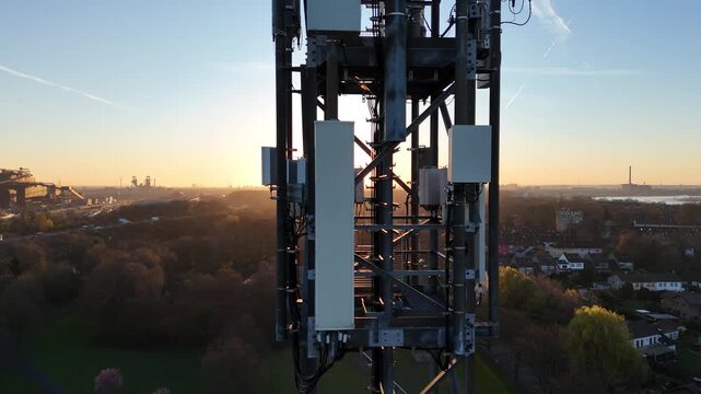 Drone flies left to right past the mast, ending with lens flare and a distant outlook from a close side perspective.