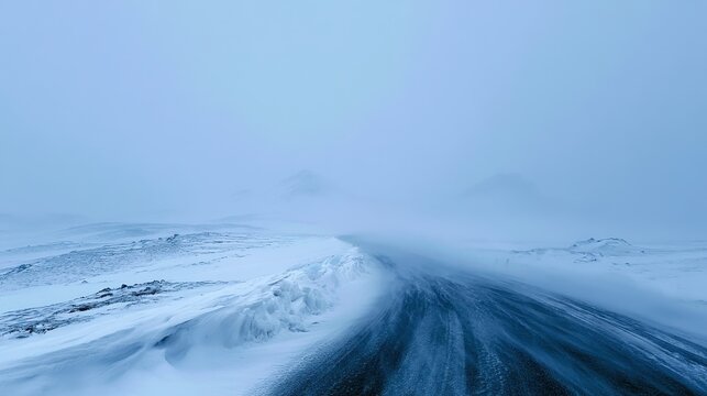 Snowstorm on a remote Icelandic road with whiteout conditions and wind-swept snow