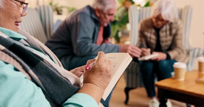 Writing, sudoku and senior woman in nursing home with game, number puzzle or book activity. Retirement, happy and elderly person with fist pump for answer, success or solution for challenge in lounge