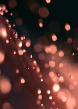 Abstract close-up of a dark background with a pinkish-red hue. the background is filled with small, circular lights that are blurred and appear to be floating in the air.