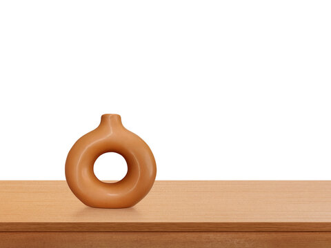 A modern-style terracotta vase sits on a wooden table PNG transparent.