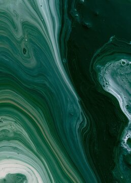 Abstract painting with a dark green background. the painting has a fluid and organic feel to it, with a mix of different shades of green and white.