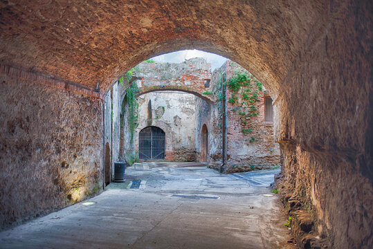 Historic brick archway and ruins inside Fortezza Nuova, Livorno, Italy
