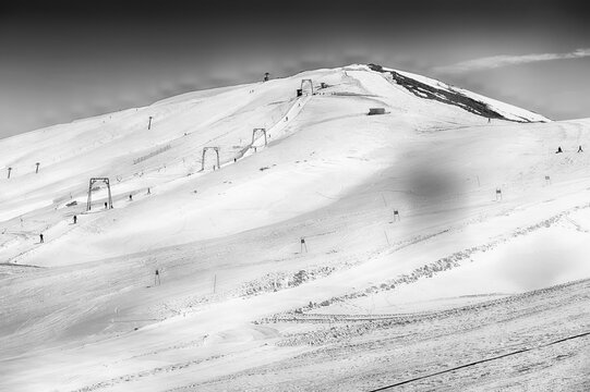 Ski resort with chairlifts and skiers, Campocatino, Italy