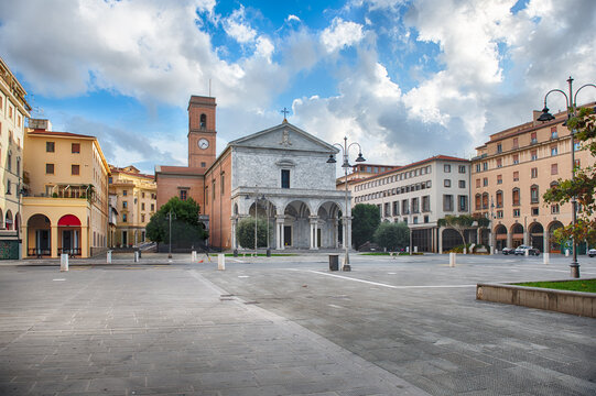 Grand facade of Livorno Cathedral with arches and columns, Italy