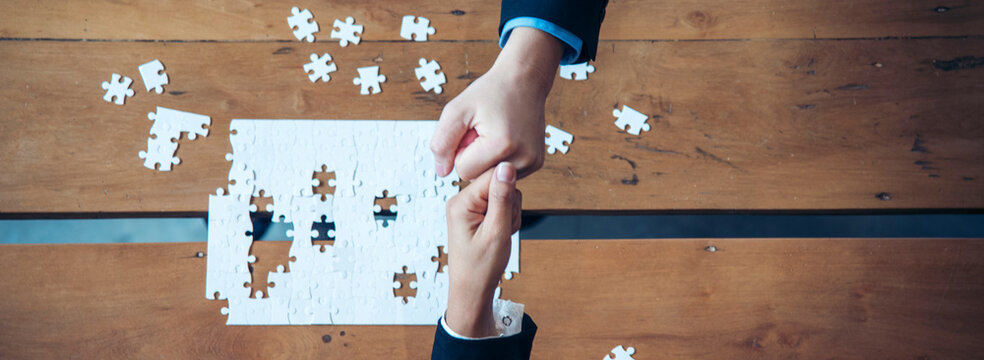 Banner Implement puzzle improve communication solve synergy team connection plan trust strategy. Piece of jigsaw assembly with copy space. Banner Business connections strategy synergy team solution