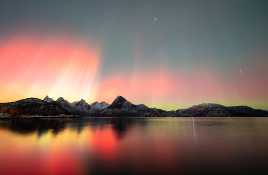 Aurora landscape of norwegian fjord during aurora storm