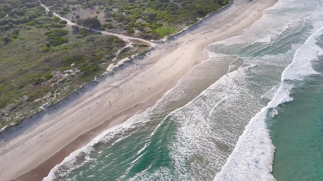 Aerial View of Waves Crashing on Main Beach Shoreline