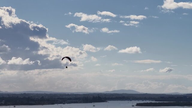 Paramotor Pilot Flying Over Surfers Paradise Coastline at Sunset