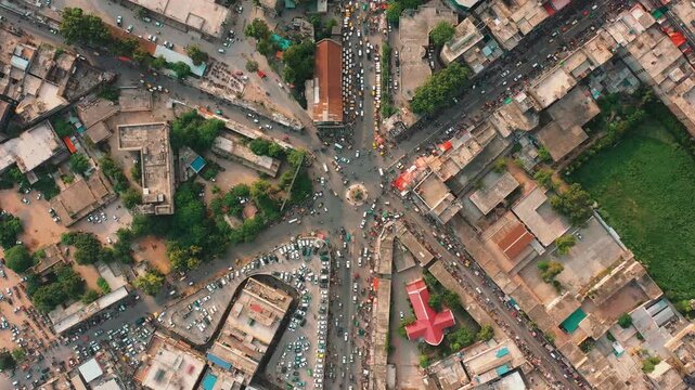 Top View of Chaotic Urban Traffic Roundabout with Fountain in Punjab Pakistan