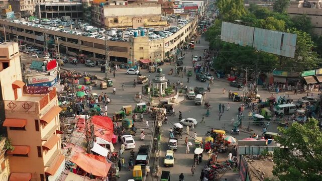 High Angle Aerial View of Urban Chowk with Shops and Traffic in Punjab Pakistan
