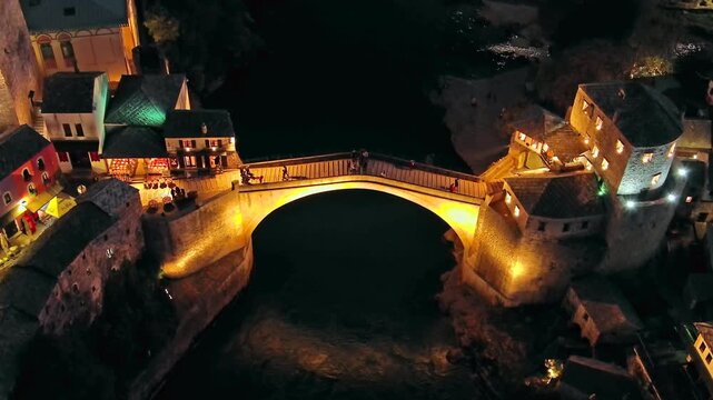 Aerial view on the Old Bridge in Mostar at night, Bosnia and Herzegovina, 4k