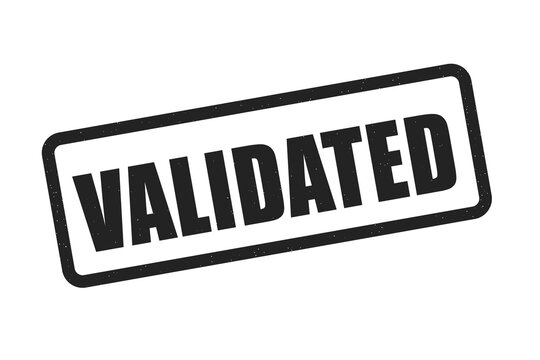 Black rubber stamp with validated text on a dark background