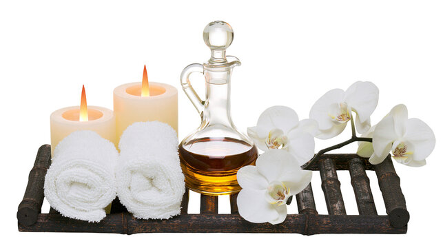 Spa massage oil bottle with lit candles rolled towels and white orchids, isolated on transparent background