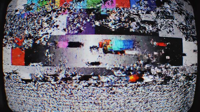 Vintage television static with test pattern transitions during a broadcast interruption