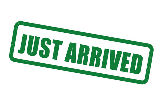 Green just arrived rubber stamp impression on a black background