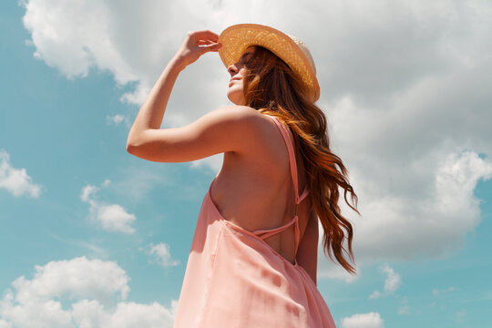 Portrait of redheaded woman enjoying sunlight