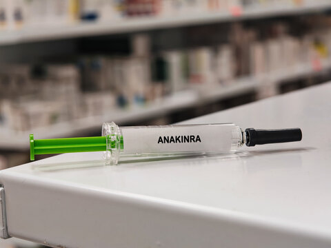 ANAKINRA IL-1 receptor antagonist for autoinflammatory disease in a prefilled syringe on pharmacy shelf with blurred background