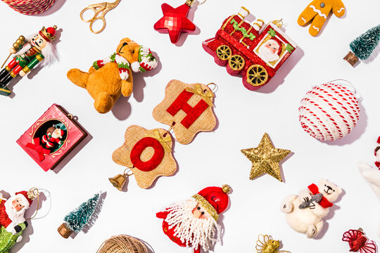 Collection of various Christmas decorations flat laid against white background