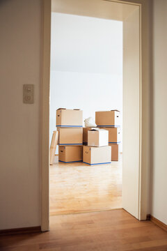 Cardboard boxes in an empty room in a new home