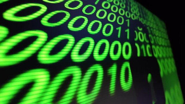 Abstract digital binary code streams displaying green data on dark screen