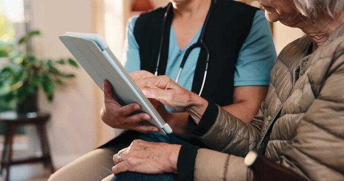 Caregiver, tablet and discussion with old woman, hands and explaining healthcare updates on website. Assisted living, nurse and chat with senior person, online and review medical diagnosis with tech