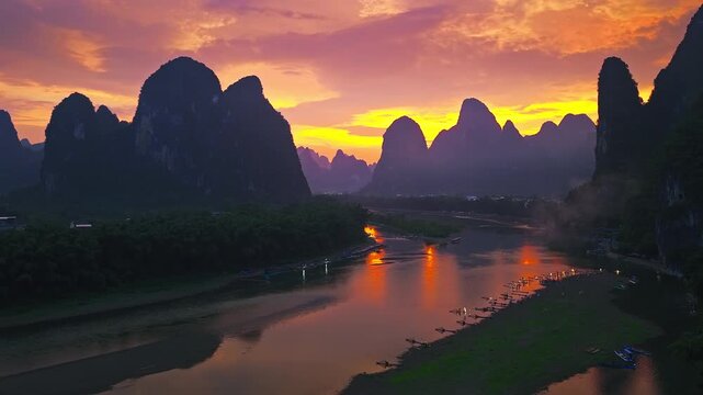 Li River winding through Guilin, Guangxi, China, at sunset, framed by karst peaks, mist, reflections, and bamboo rafts, offering valuable travel imagery.