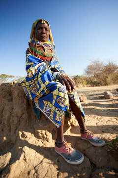 Traditional Muhila wearing her sneakers, Kehamba, Chibia, Angola